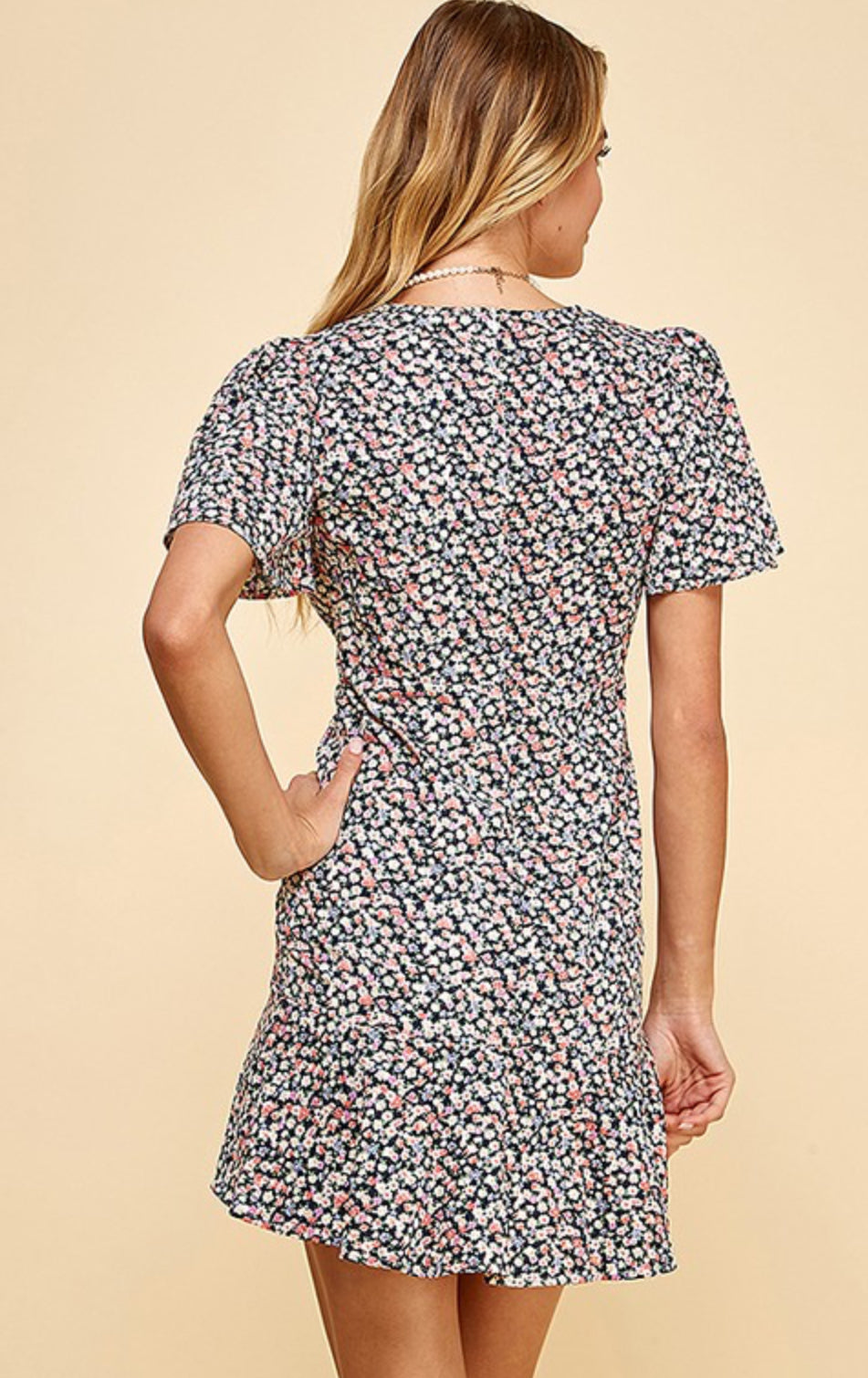 Floral mini dress with ruffle sleeves and hem